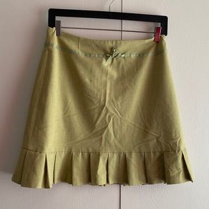 Green pleated mini skirt